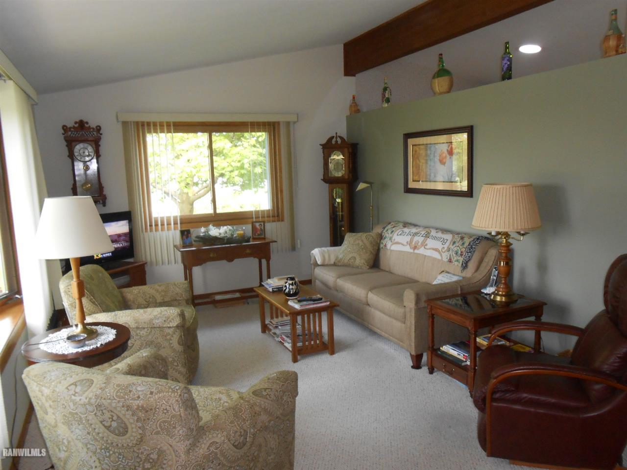 301 East Town Line Road Lena, IL 61048 - Photo 7 of 23 a living room with furniture and a lamp