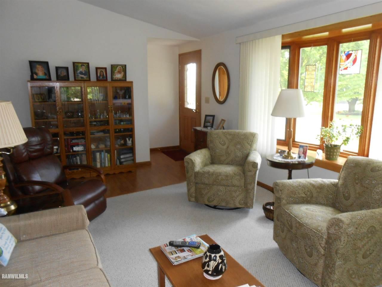 301 East Town Line Road Lena, IL 61048 - Photo 8 of 23 a living room with furniture and a large window
