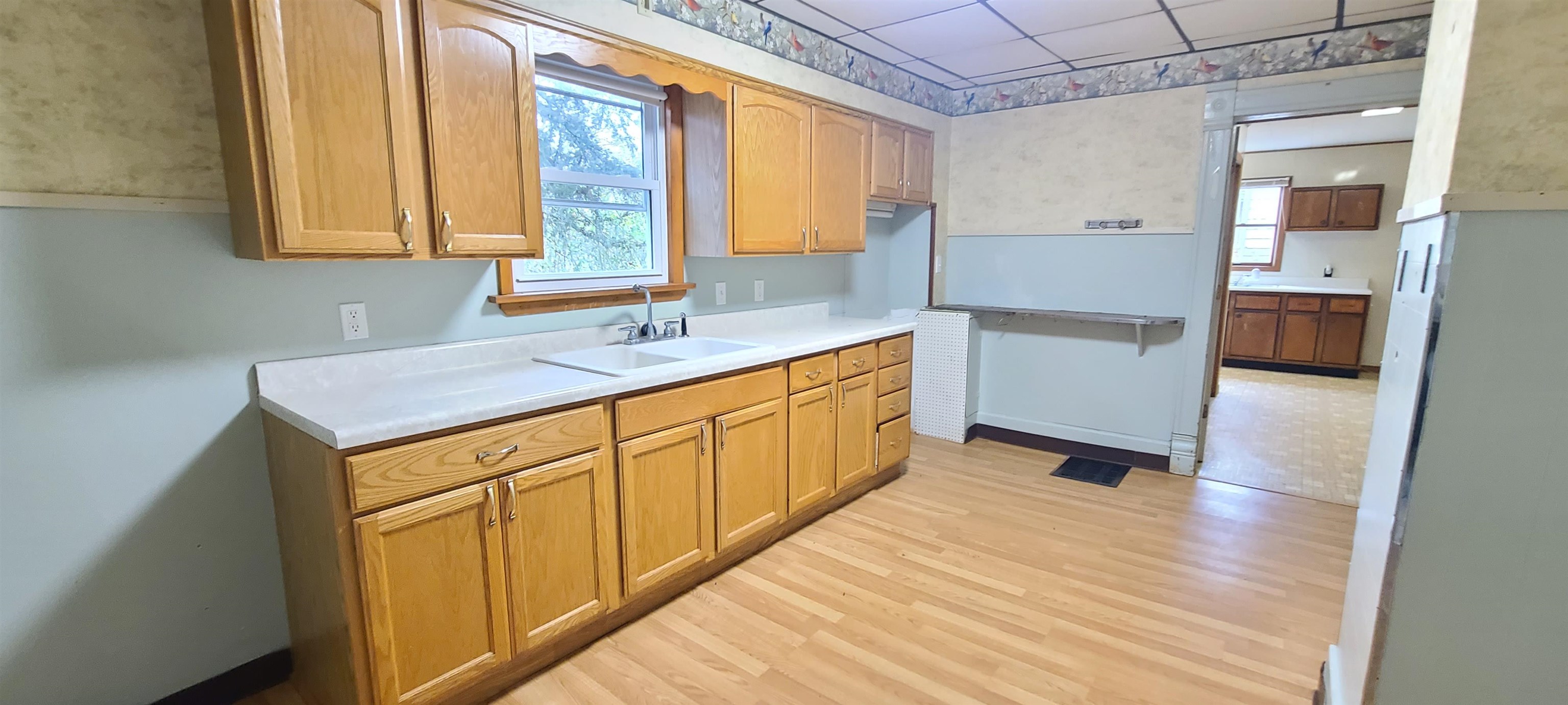 507 Lester Street Mount Carroll, IL 61053 - Photo 23 of 25 a kitchen with a sink stove and cabinets