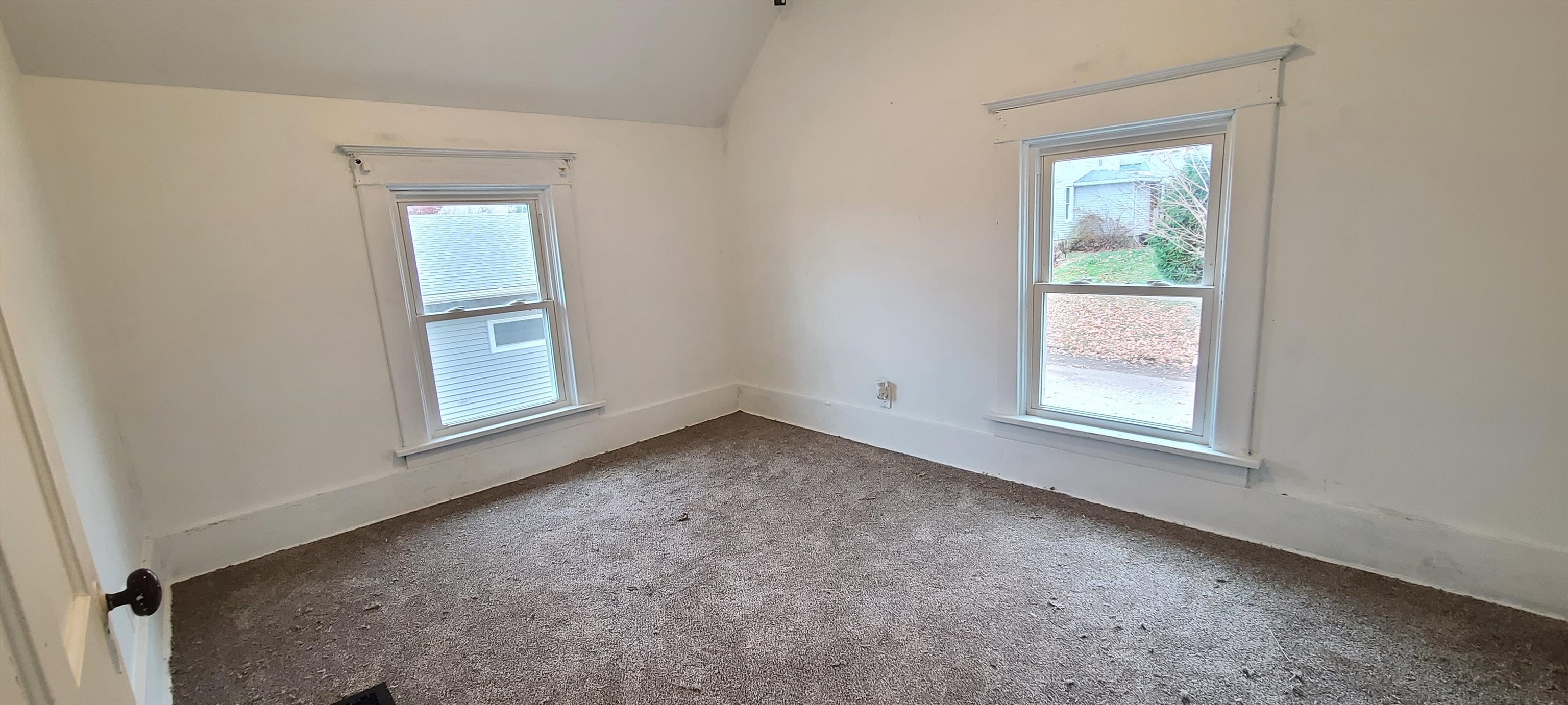 507 Lester Street Mount Carroll, IL 61053 - Photo 9 of 25 an empty room with windows