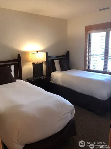 a bedroom with bed and window