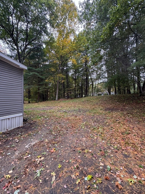 42 Kendell Lane Salisbury, MA 01952 - Photo 4 of 15 a backyard of a house with lots of green space