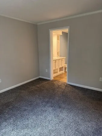 a view of an empty room and a window