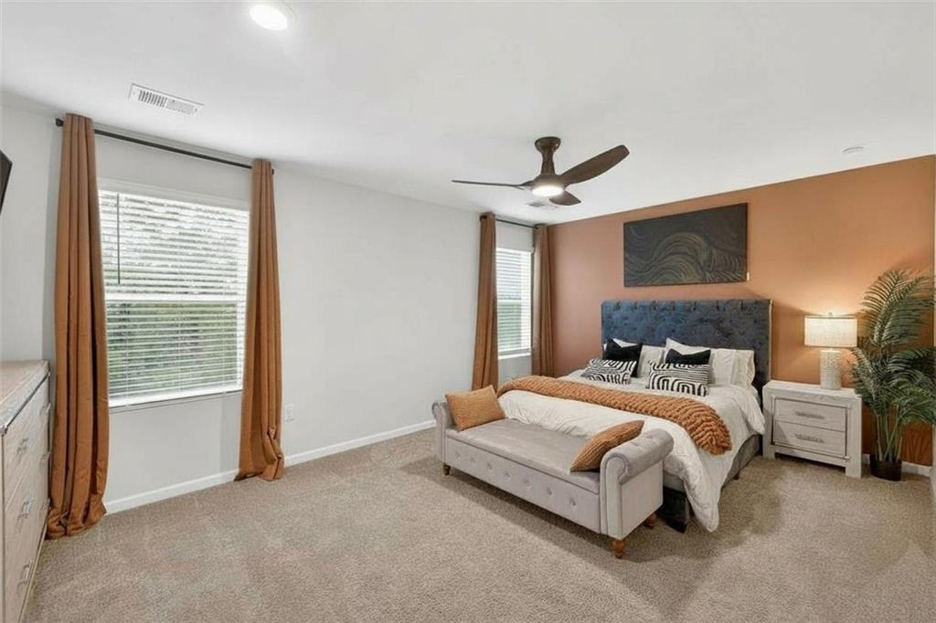 480 Overlook Road Covington, GA 30014 - Photo 5 of 20 a bedroom with a bed and a ceiling fan