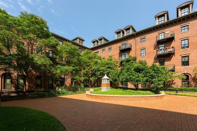 a front view of a house with a yard and a garage