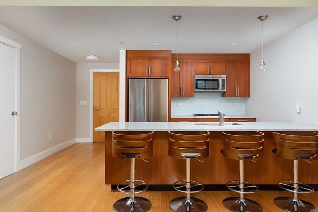 a kitchen with a sink cabinets and window