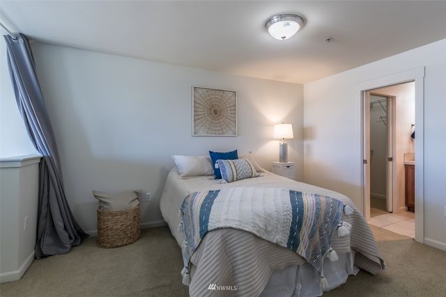 a bedroom with a bed and gym equipment