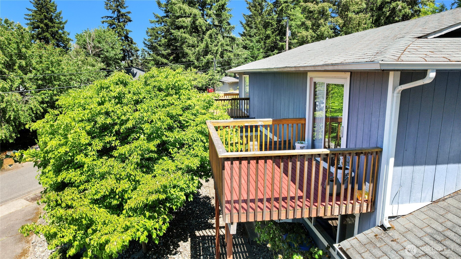 2533 Fir Avenue Bremerton, WA 98310 - Photo 28 of 38 a view of a brick house with a small yard and wooden floor