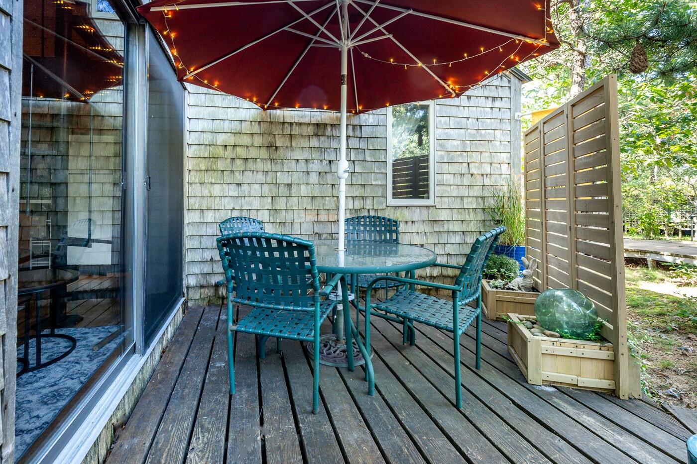 1780 Route 6, Unit D3 Wellfleet, MA 02667 - Photo 11 of 25 a view of balcony with wooden floor and outdoor seating