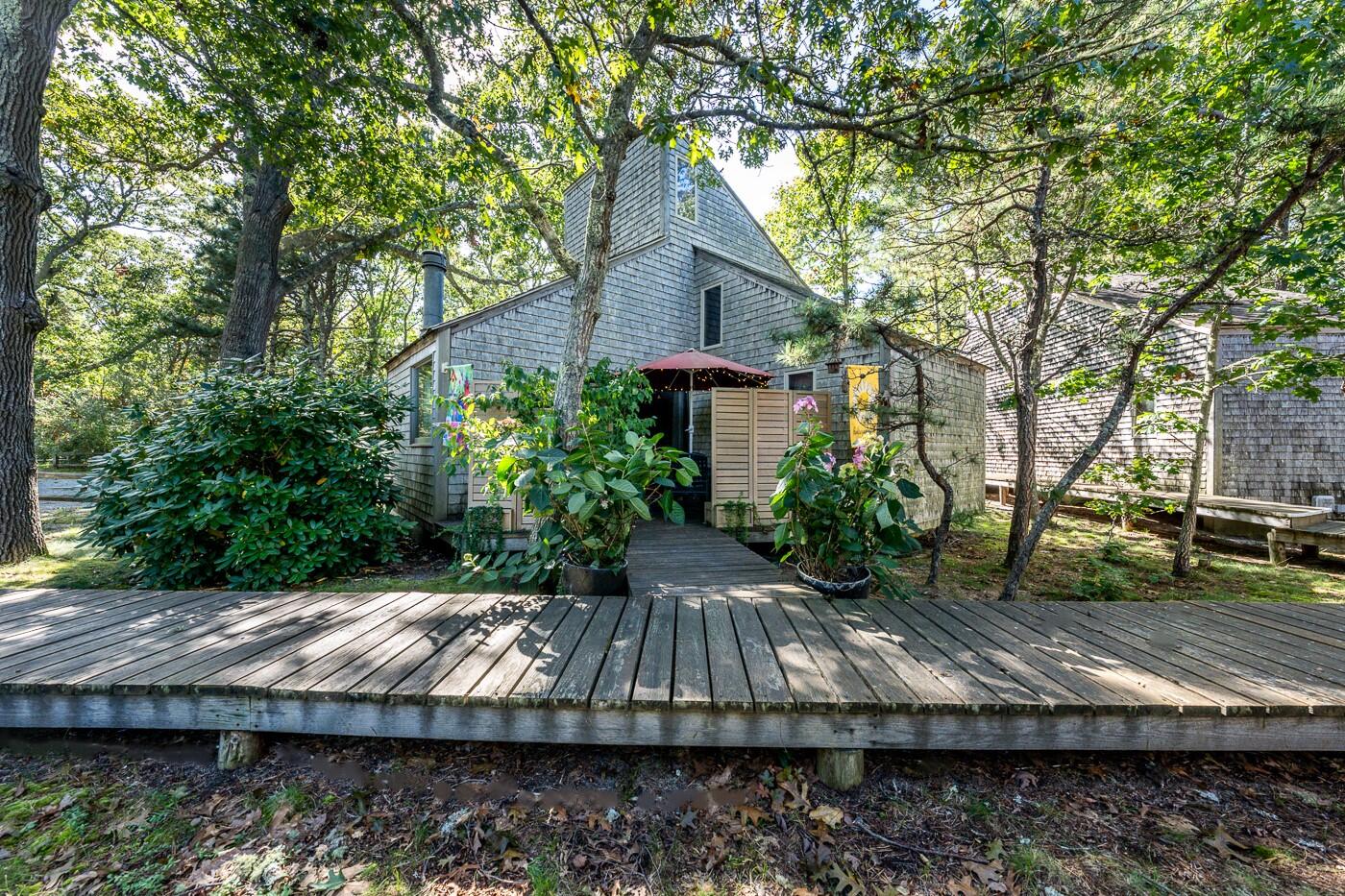 1780 Route 6, Unit D3 Wellfleet, MA 02667 - Photo 12 of 25 a view of backyard with green space