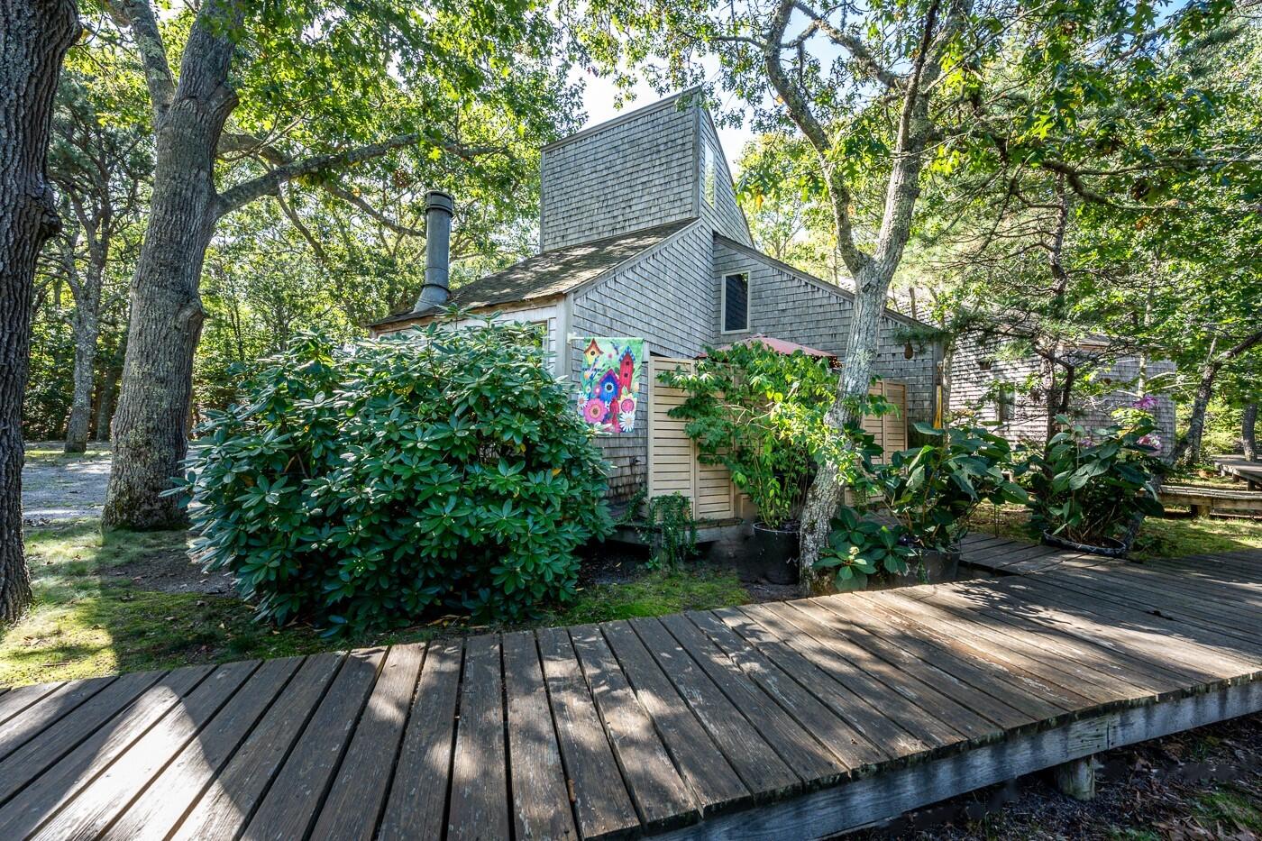 1780 Route 6, Unit D3 Wellfleet, MA 02667 - Photo 13 of 25 a view of backyard with green space