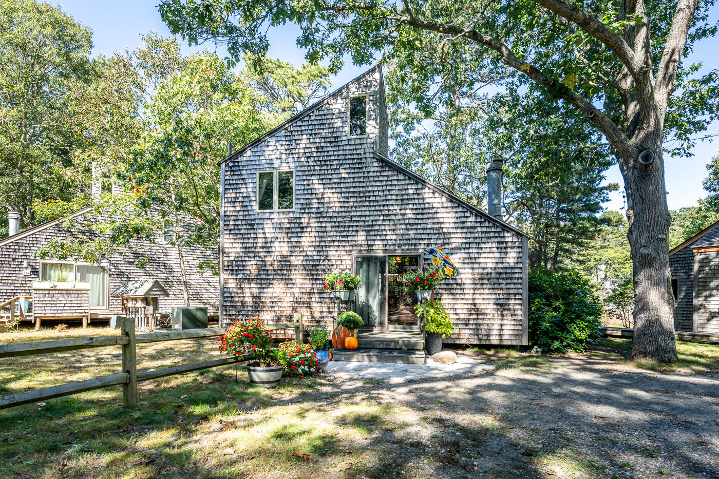 1780 Route 6, Unit D3 Wellfleet, MA 02667 - Photo 21 of 25 a view of a house with backyard and sitting area