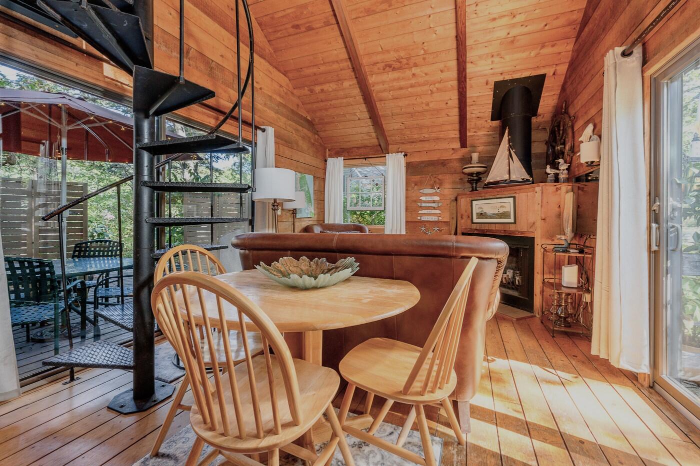 1780 Route 6, Unit D3 Wellfleet, MA 02667 - Photo 9 of 25 a view of a dining room with furniture window and outside view