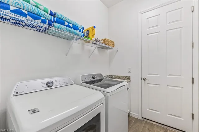 a utility room with dryer and washer
