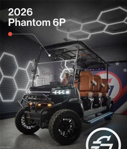 a view of a white house next to a yard