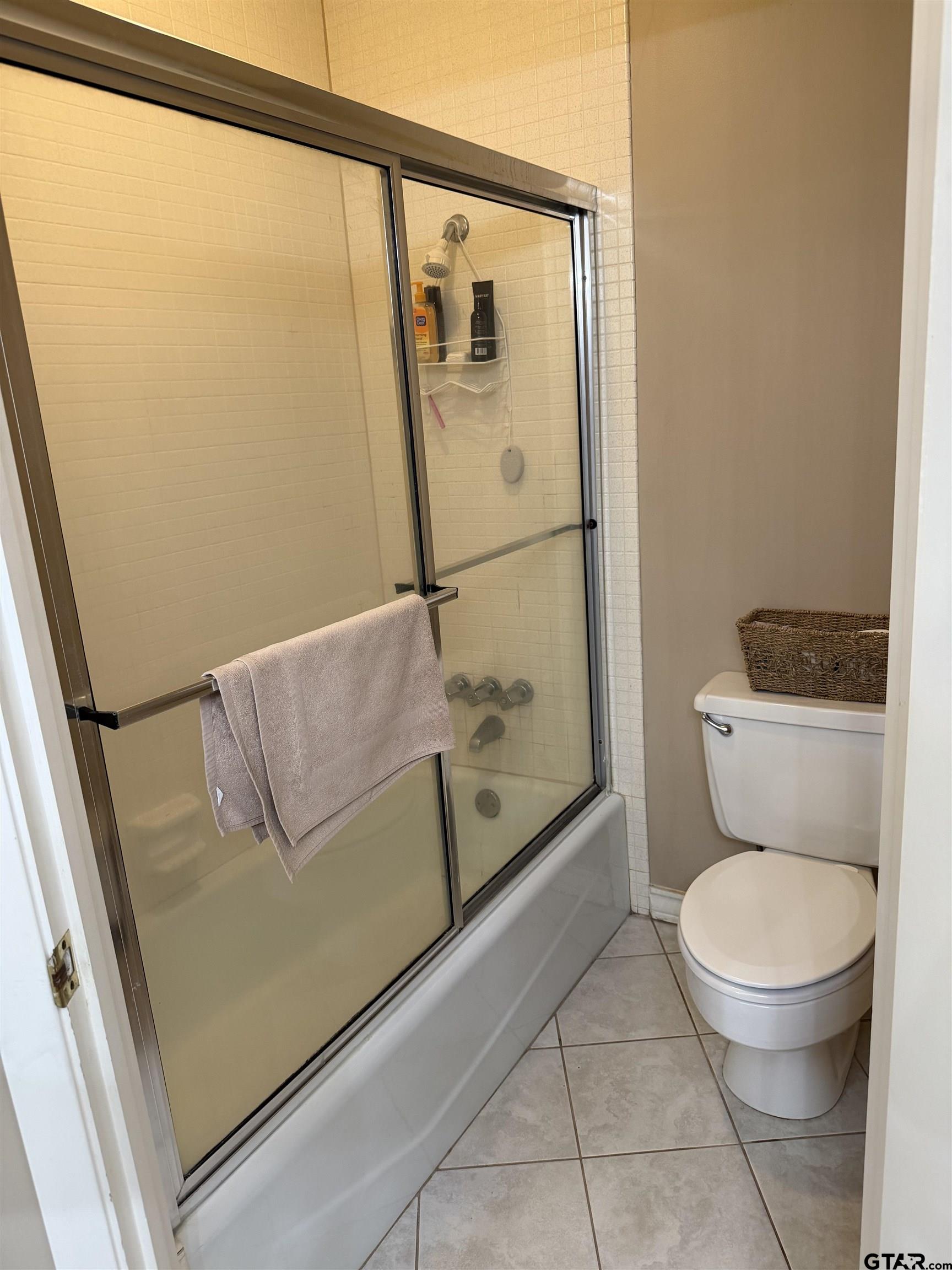 5704 Foxcroft Road Tyler, TX 75703 - Photo 10 of 10 a bathroom with a toilet and a shower