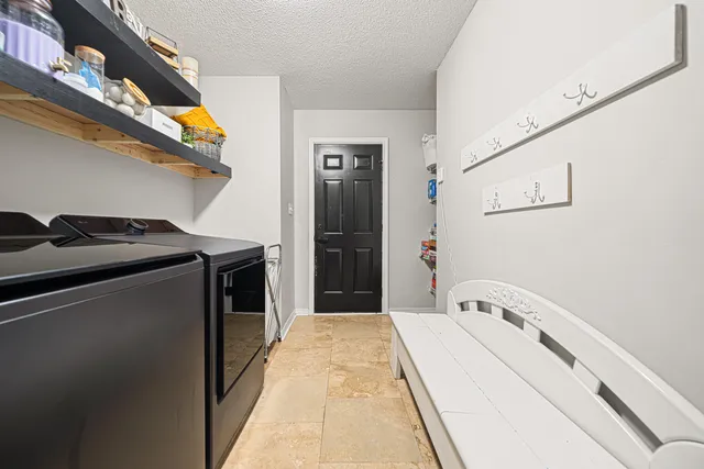 a hallway with washer and dryer