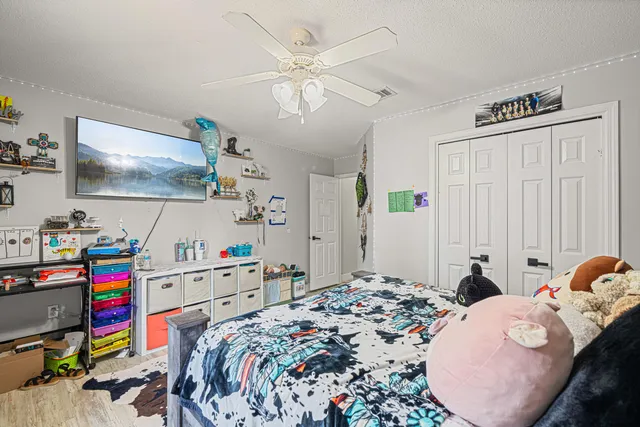 a bed room with a bed and a flat screen tv