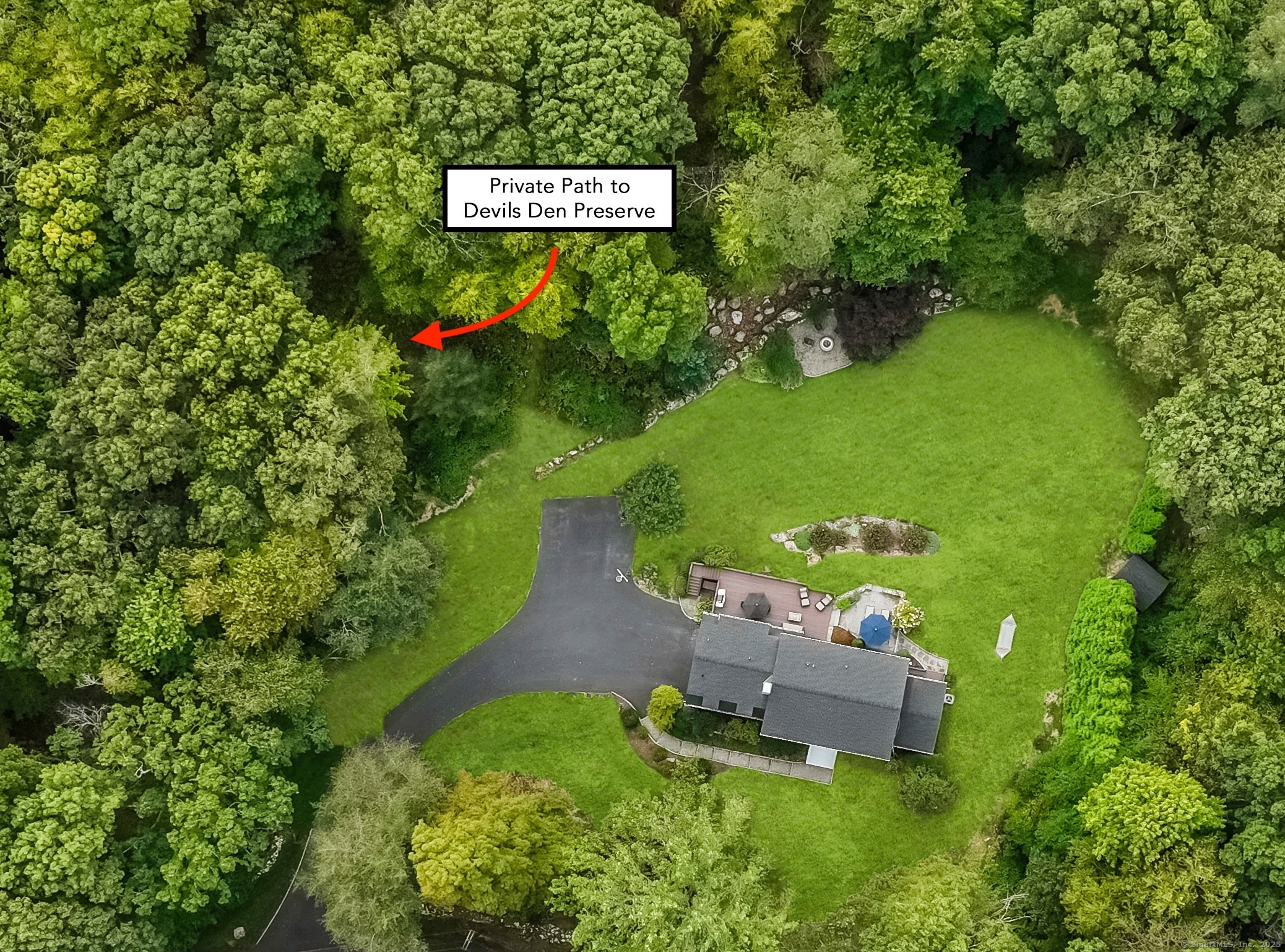 48 Blue Spruce Circle Weston, CT 06883 - Photo 1 of 1 a sign that is sitting in the grass next to a road