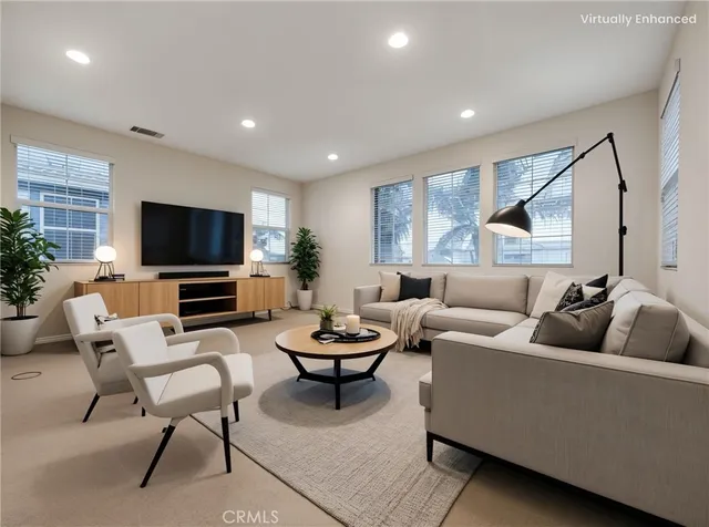 a large spacious bathroom with a granite countertop double vanity sink a mirror and a bathtub