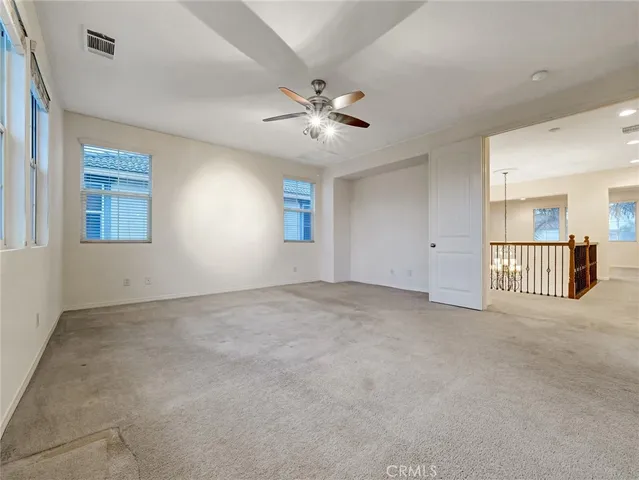 a white toilet sitting next to a bath tub