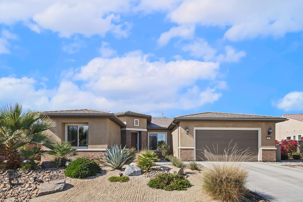 77 Barolo Rancho Mirage, CA 92270 - Photo 12 of 61 a front view of a house with garden