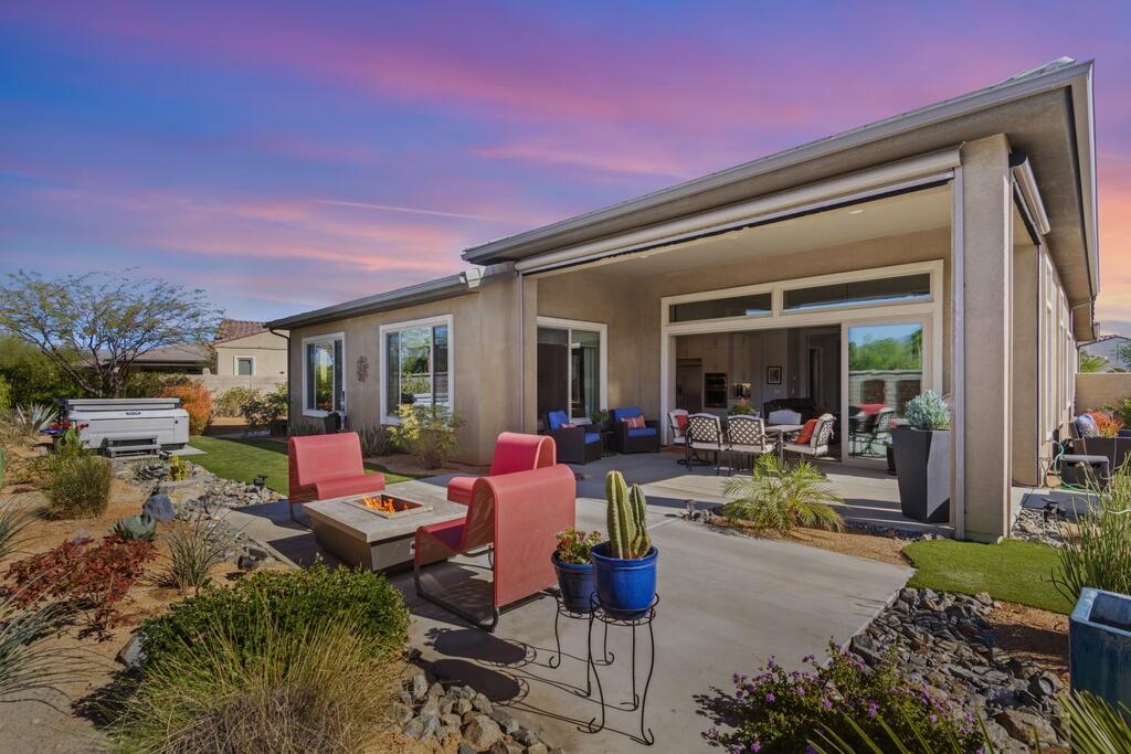 77 Barolo Rancho Mirage, CA 92270 - Photo 13 of 61 a view of a house with backyard sitting area and garden