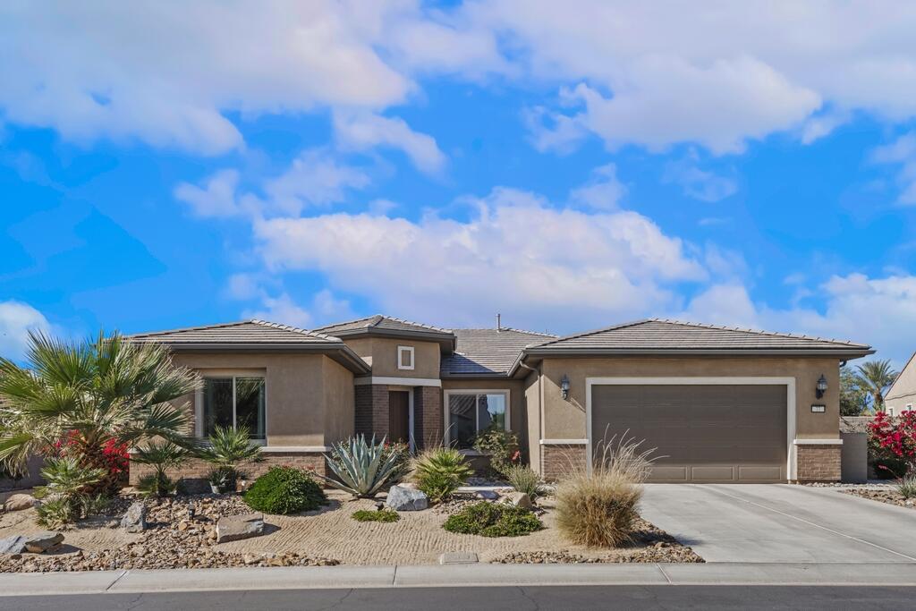 77 Barolo Rancho Mirage, CA 92270 - Photo 17 of 61 a front view of a house with garden