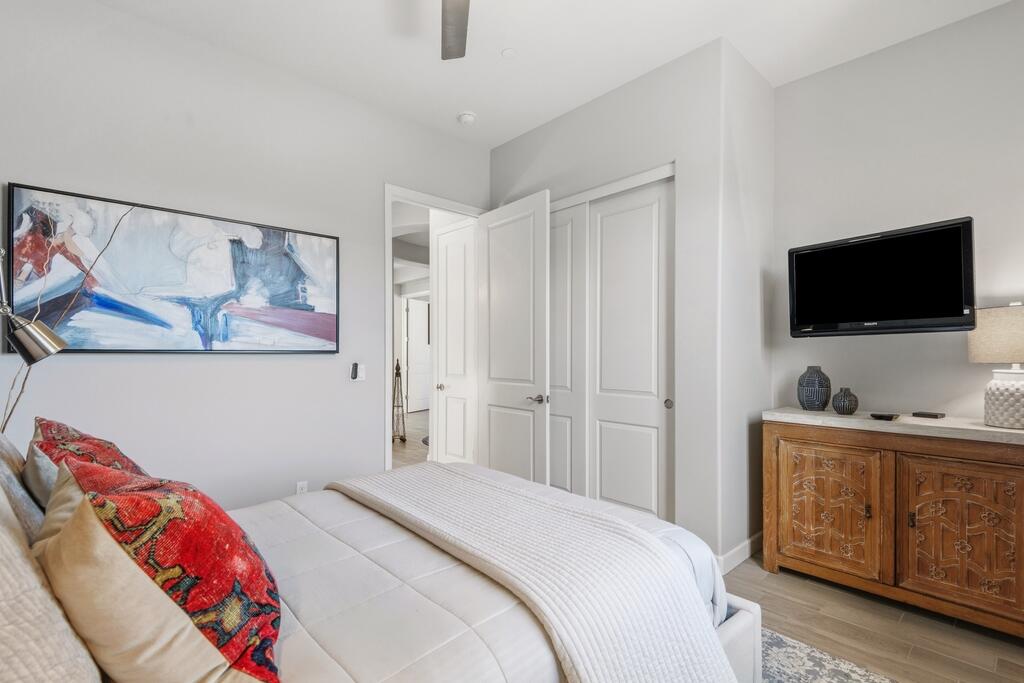 77 Barolo Rancho Mirage, CA 92270 - Photo 31 of 61 a bedroom with a bed and a flat screen tv