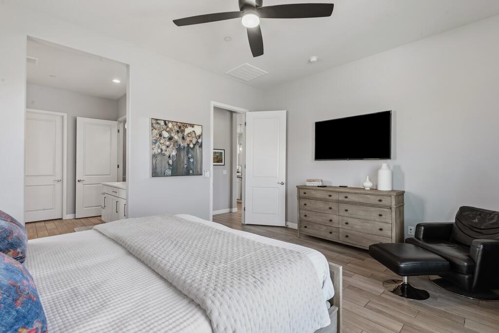 77 Barolo Rancho Mirage, CA 92270 - Photo 32 of 61 a bedroom with a bed and a flat screen tv