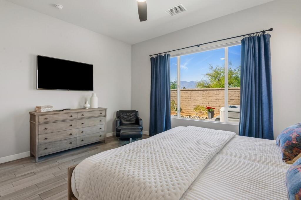 77 Barolo Rancho Mirage, CA 92270 - Photo 33 of 61 a bedroom with a bed and a flat screen tv