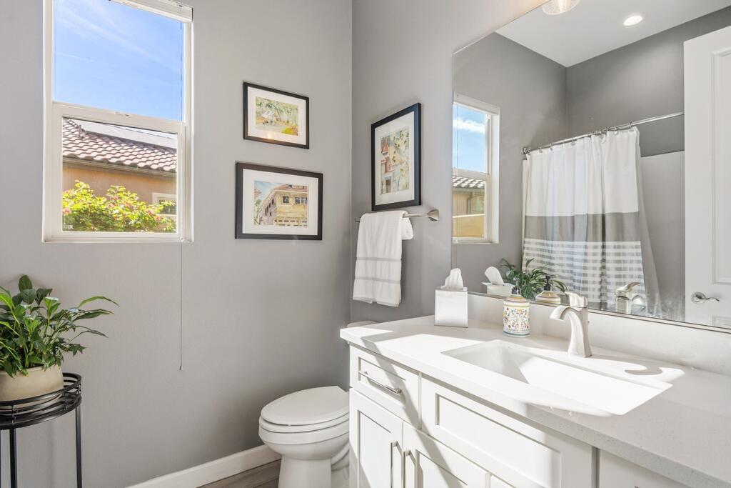 77 Barolo Rancho Mirage, CA 92270 - Photo 34 of 61 a bathroom with a granite countertop sink and a toilet