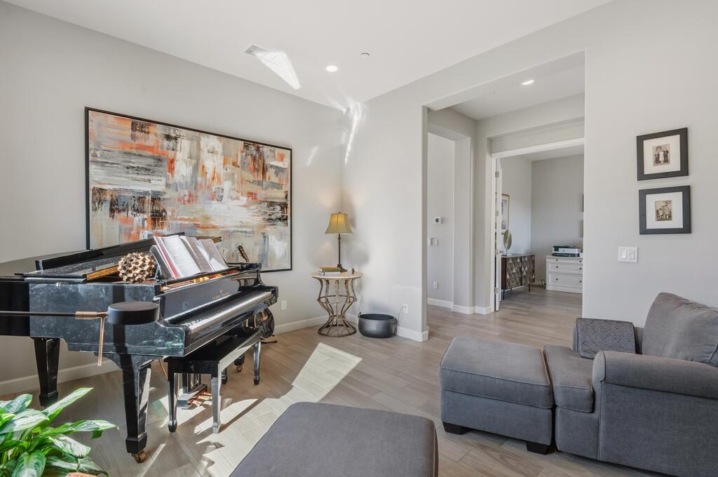 77 Barolo Rancho Mirage, CA 92270 - Photo 39 of 61 a living room with furniture and a piano