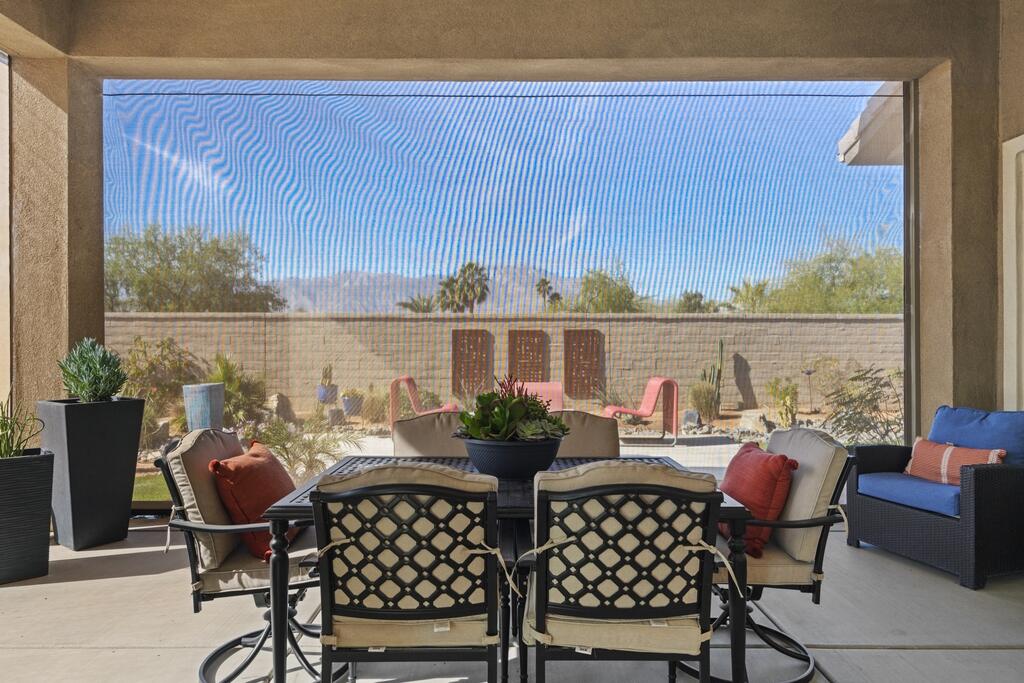 77 Barolo Rancho Mirage, CA 92270 - Photo 44 of 61 a view of a dining room with furniture window and outside view