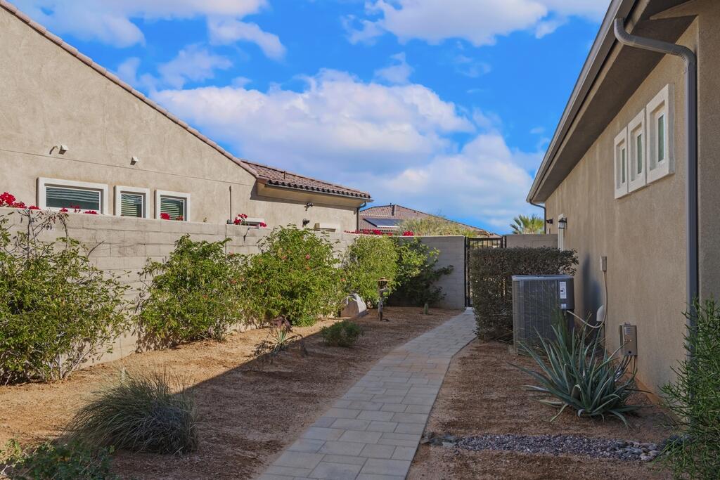 77 Barolo Rancho Mirage, CA 92270 - Photo 53 of 61 a front view of a house with a yard