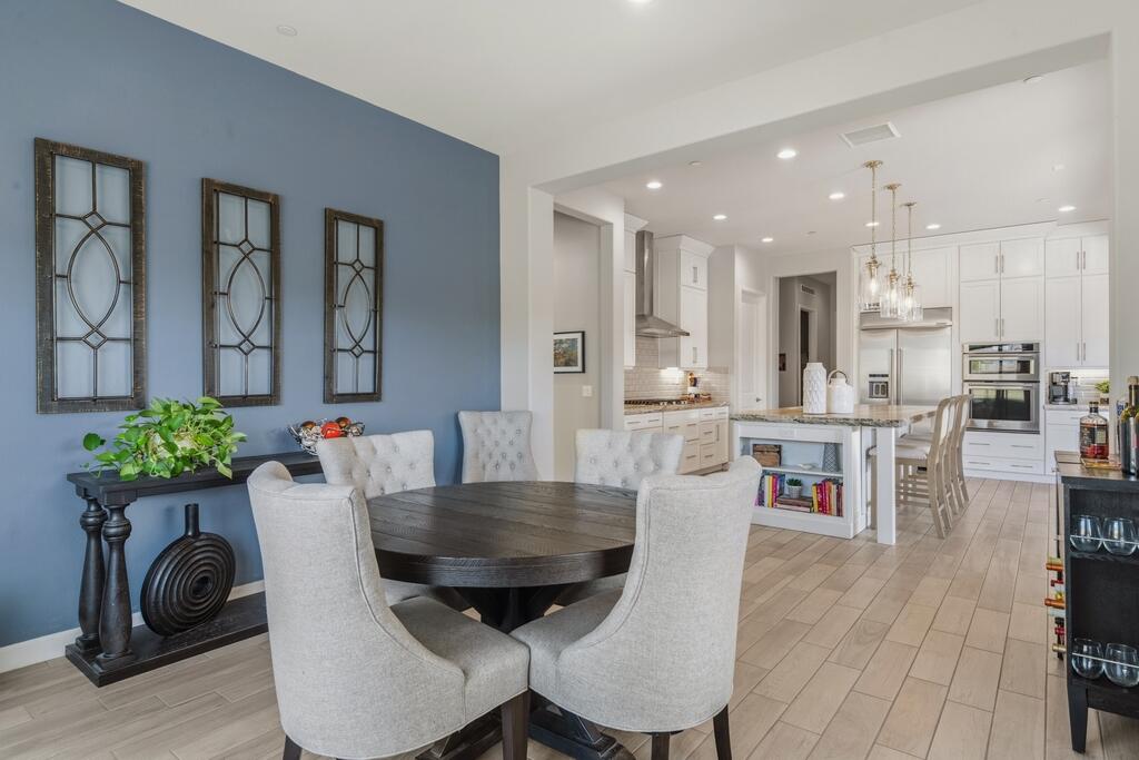 77 Barolo Rancho Mirage, CA 92270 - Photo 7 of 61 a dining room with furniture and a potted plant