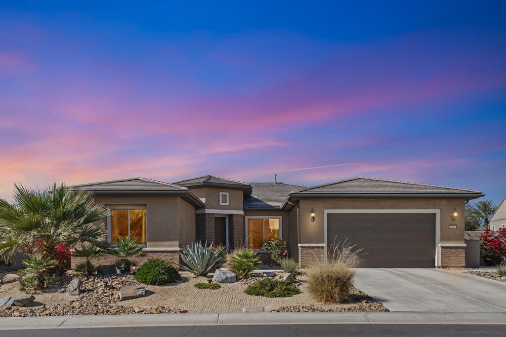 77 Barolo Rancho Mirage, CA 92270 - Photo 8 of 61 a front view of a house with garden