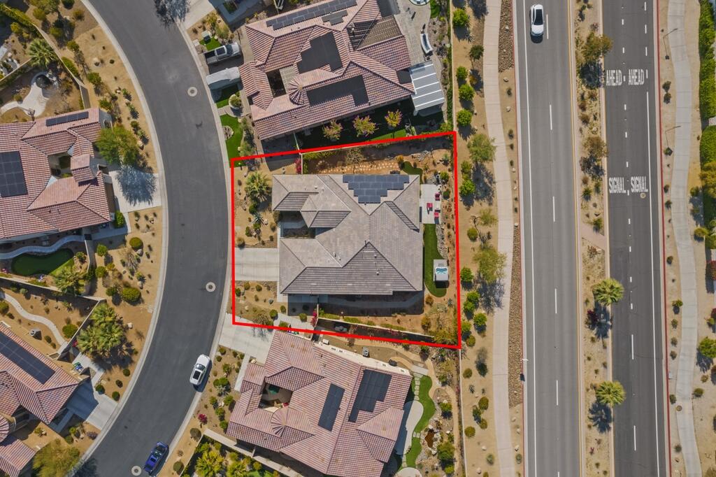 77 Barolo Rancho Mirage, CA 92270 - Photo 10 of 61 an aerial view of a house with a couple of cars parked in front of it