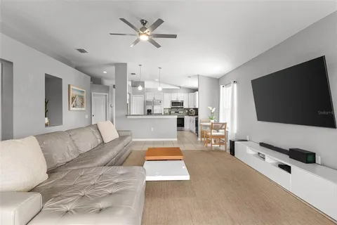 a living room with furniture and a flat screen tv