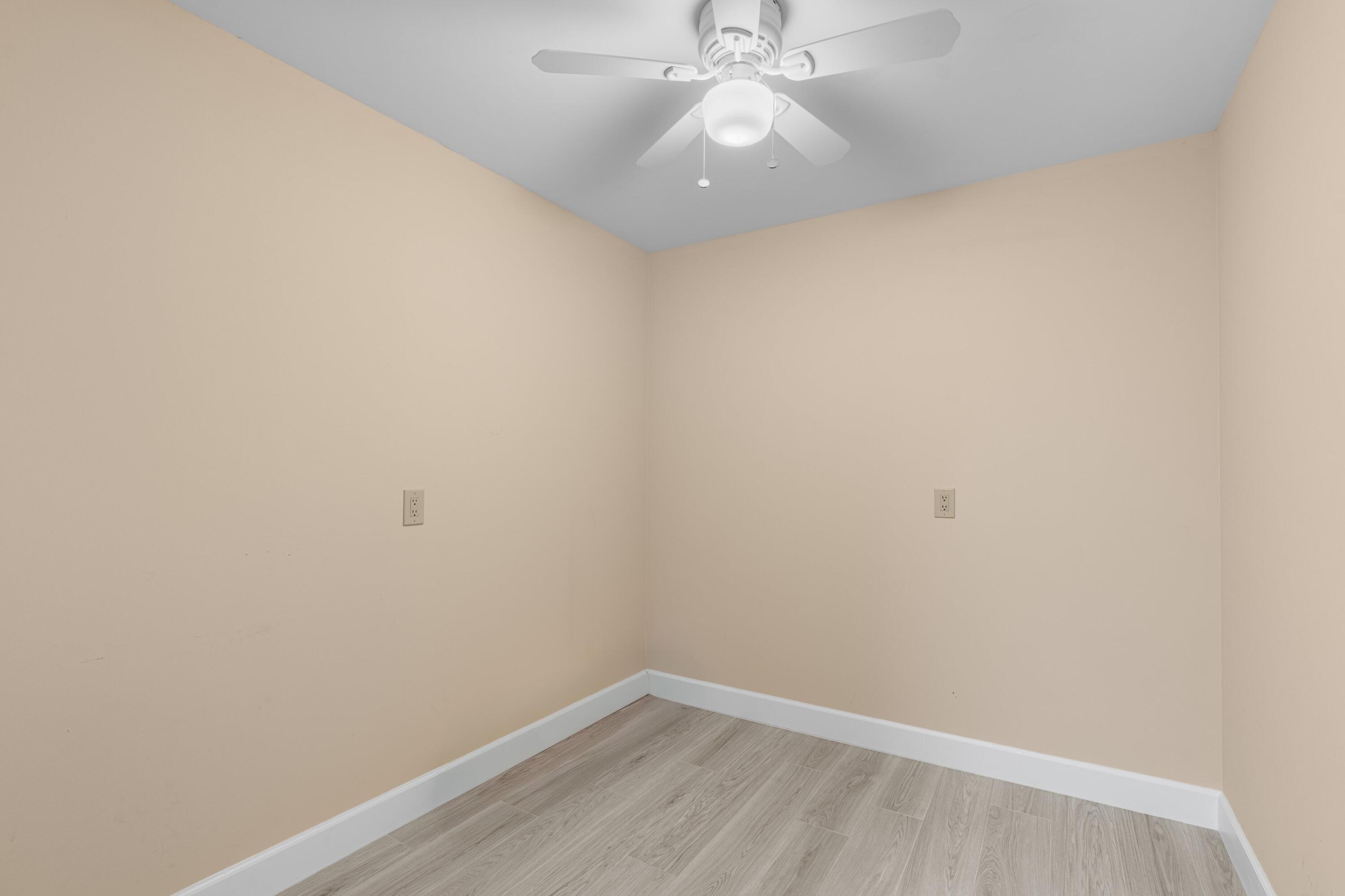 6025 Balboa Circle, Unit 406 Boca Raton, FL 33433 - Photo 18 of 33 an empty room with a fan & a window