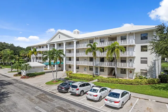 a front view of a house with a garden and patio
