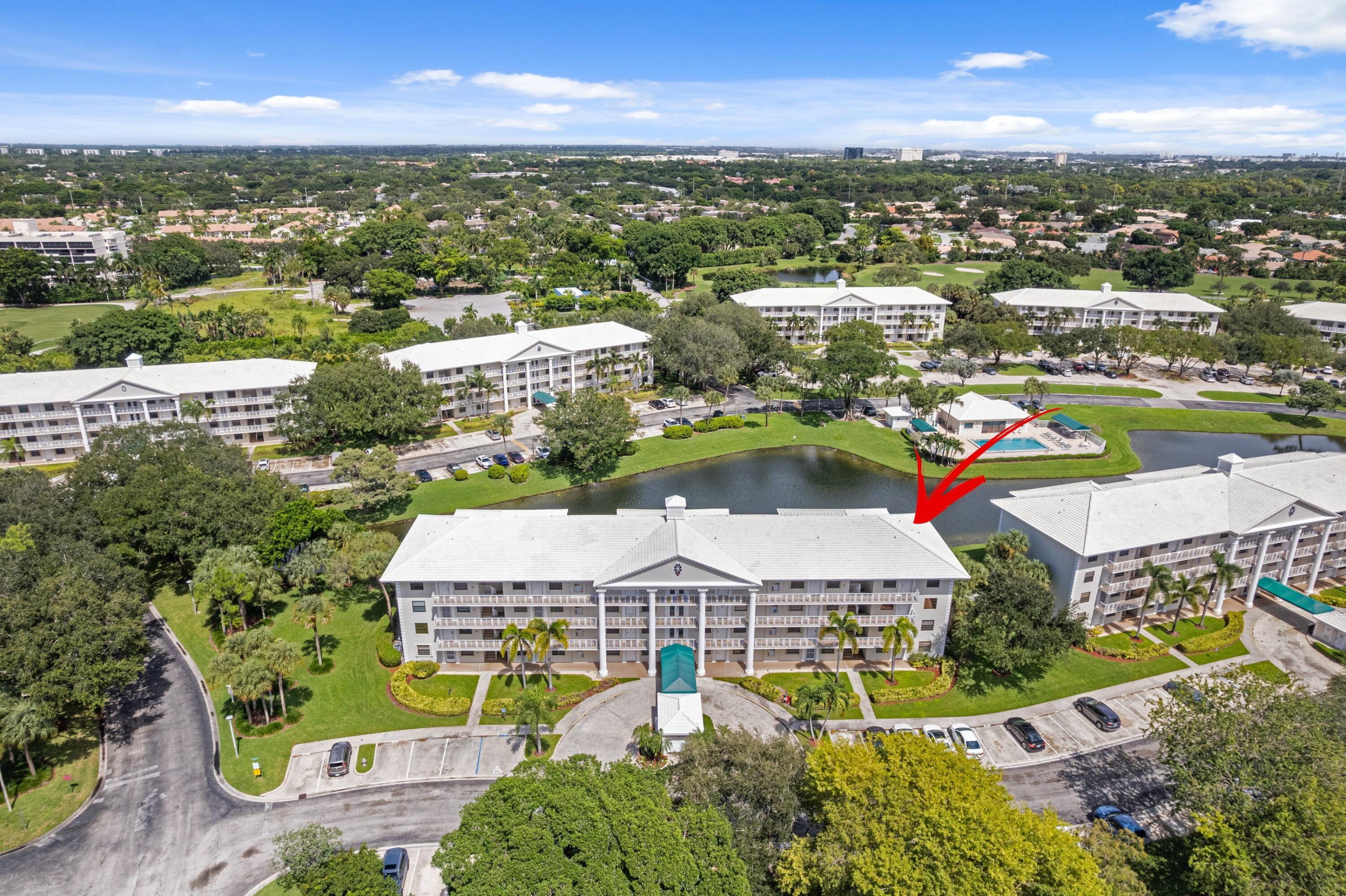 6025 Balboa Circle, Unit 406 Boca Raton, FL 33433 - Photo 27 of 33 an aerial view of residential houses with outdoor space and seating area