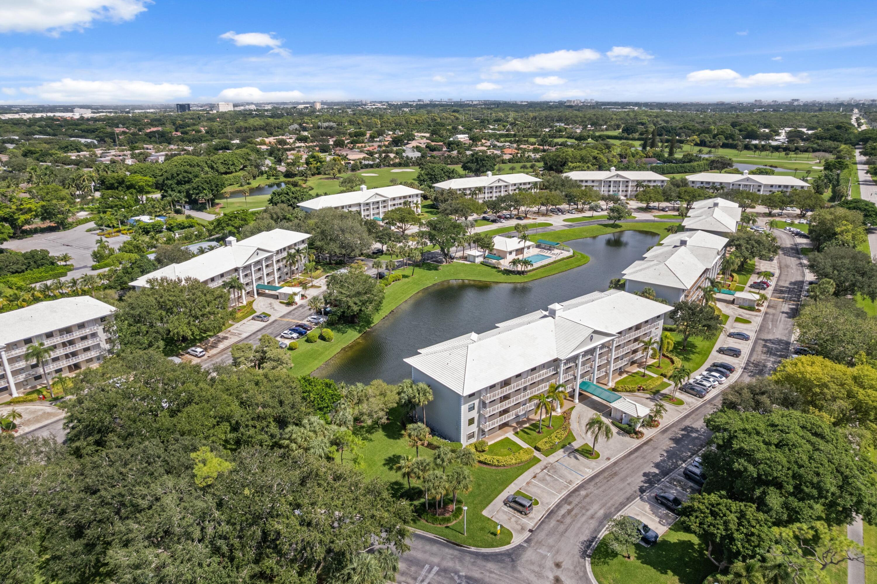 6025 Balboa Circle, Unit 406 Boca Raton, FL 33433 - Photo 31 of 33 an aerial view of residential houses with outdoor space and river