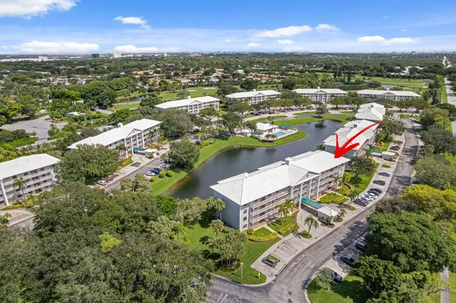 an aerial view of residential houses with outdoor space and river
