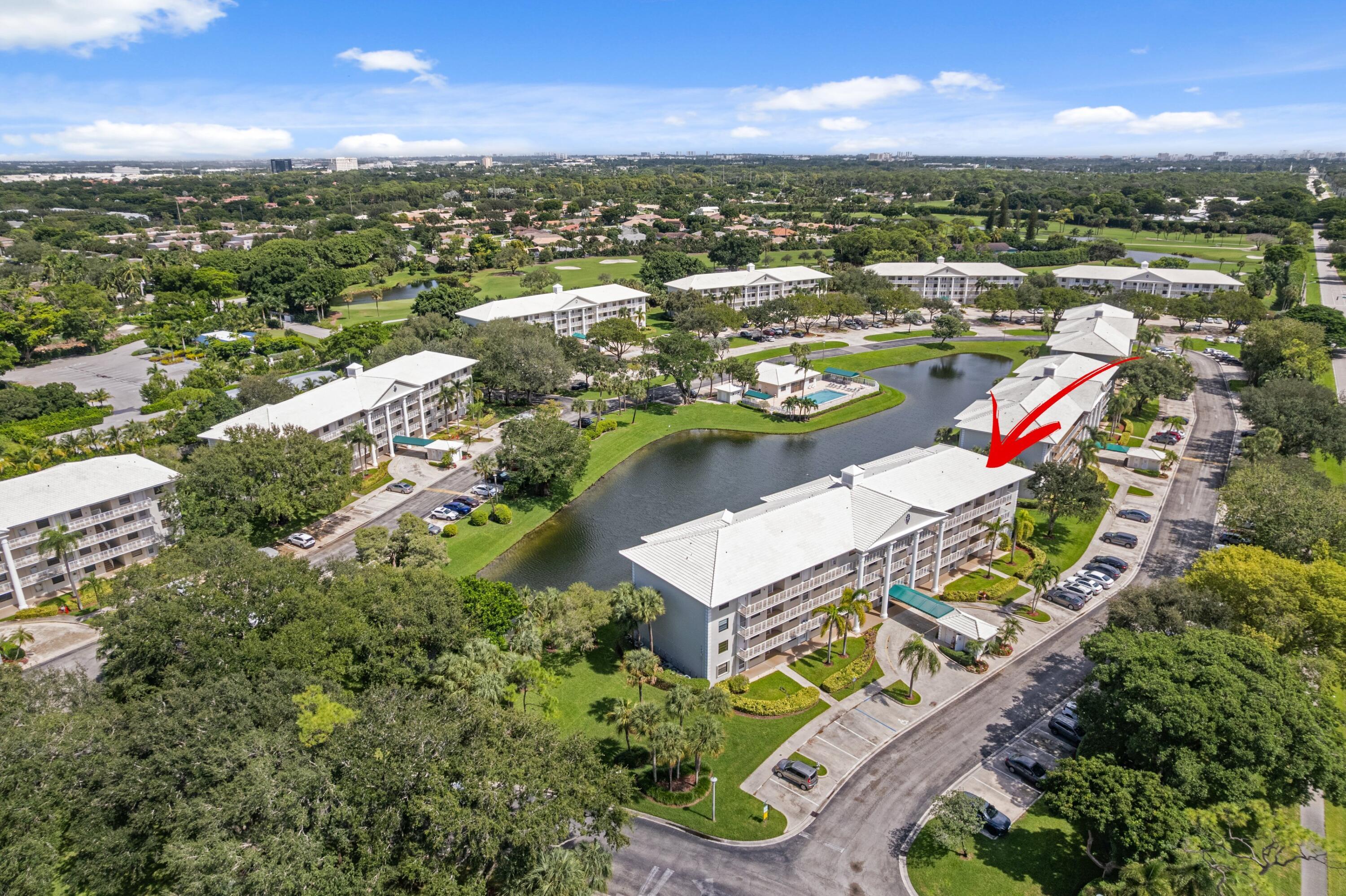 6025 Balboa Circle, Unit 406 Boca Raton, FL 33433 - Photo 32 of 33 an aerial view of residential houses with outdoor space and river