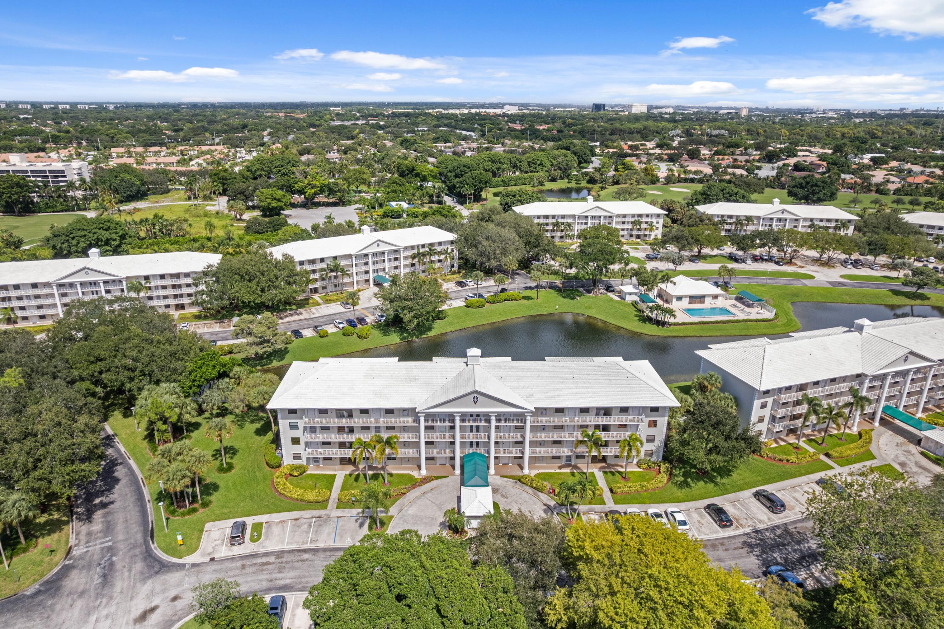 6025 Balboa Circle, Unit 406 Boca Raton, FL 33433 - Photo 33 of 33 an aerial view of residential houses with outdoor space and river