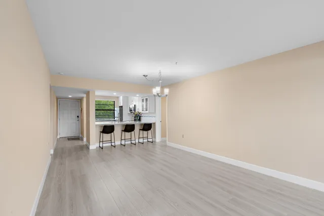 a view of a livingroom with furniture and wooden floor