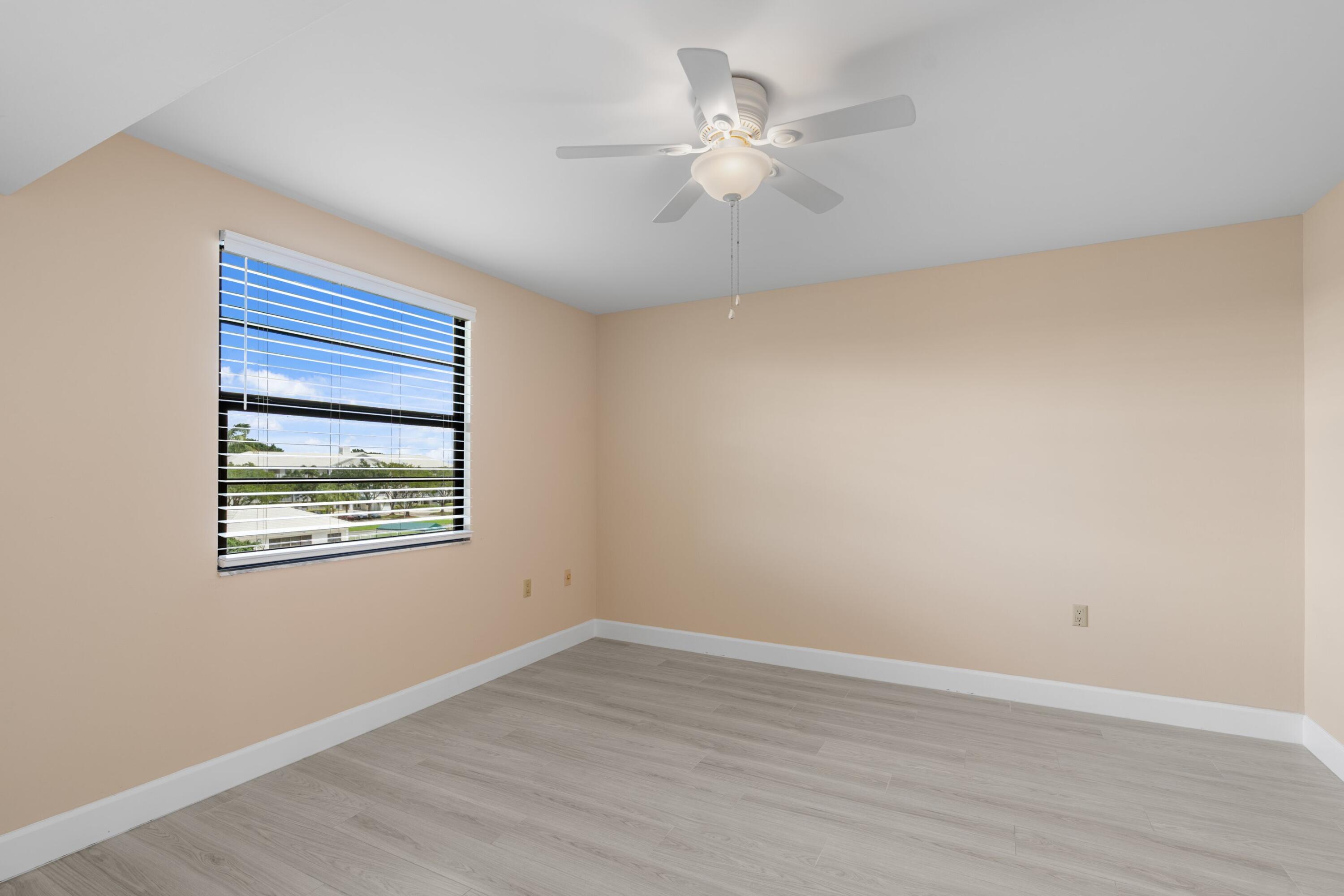 6025 Balboa Circle, Unit 406 Boca Raton, FL 33433 - Photo 10 of 33 an empty room with a window