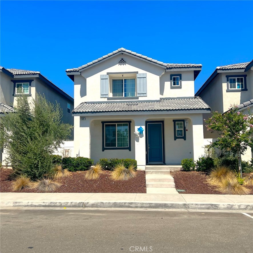 504 Villa Way Colton, CA 92324 - Photo 1 of 13 a front view of a house with a yard