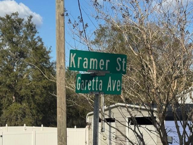 35367 Kramer Street Webster, FL 33597 - Photo 2 of 13 a street sign on a pole on a street